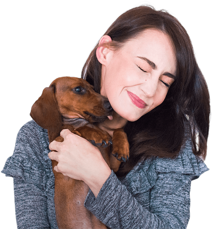 beautiful young lady holding her pup